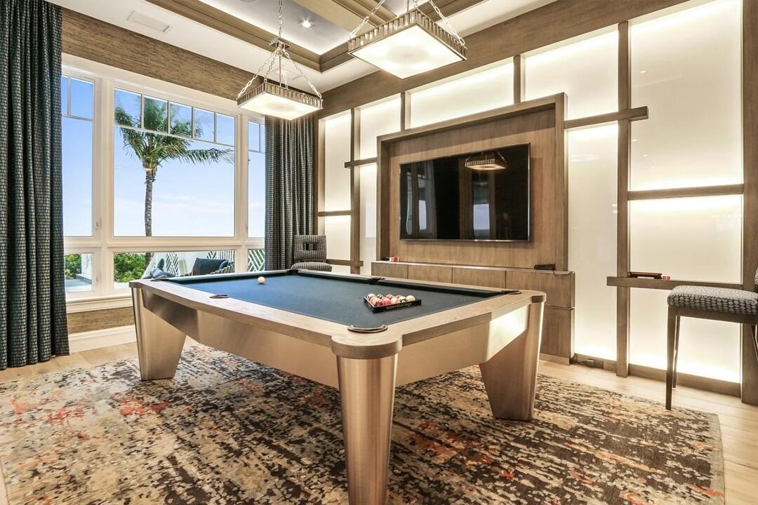 Games room with billiards table.
